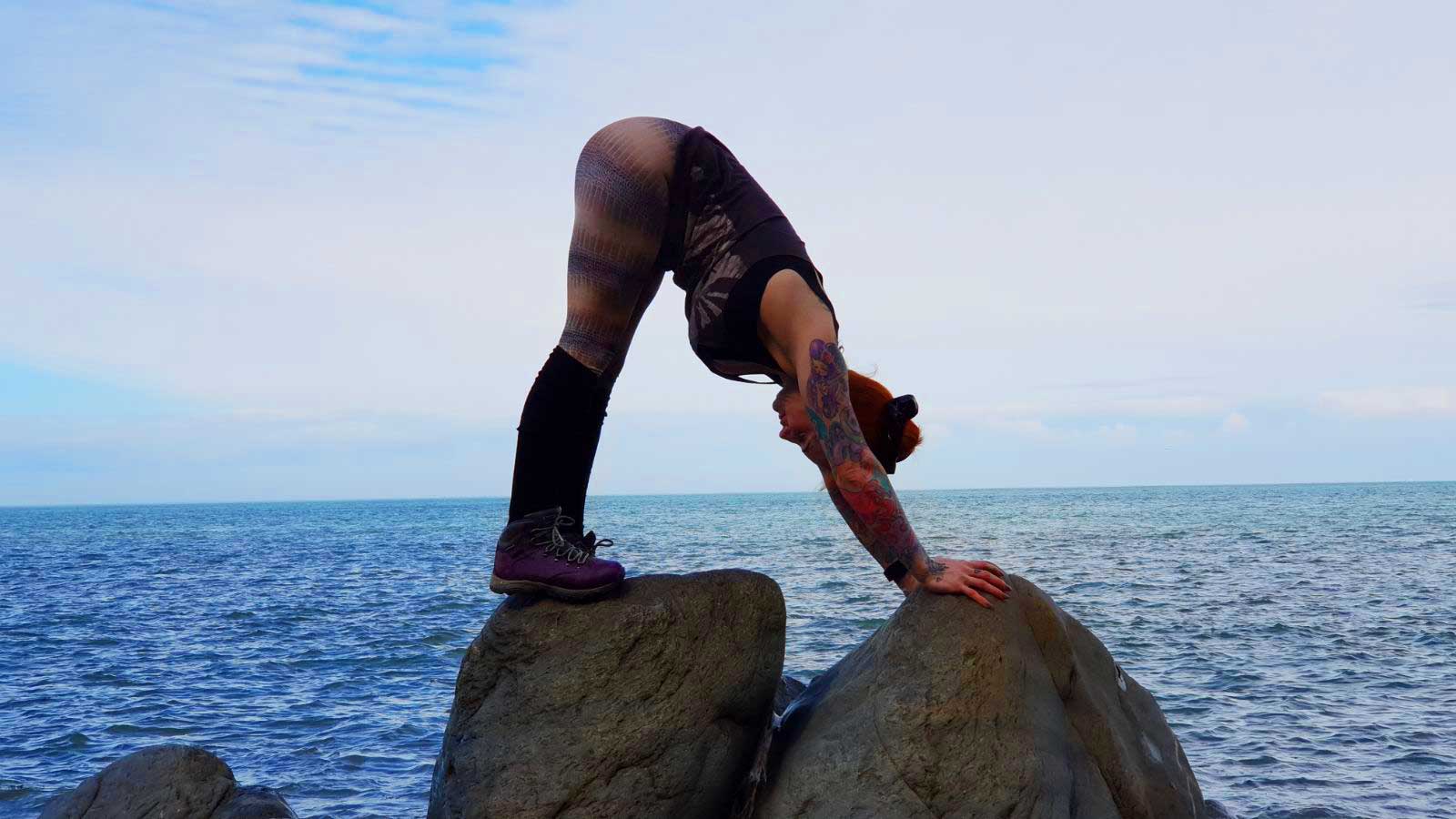 An image of Kelly performing Yoga by the Sea